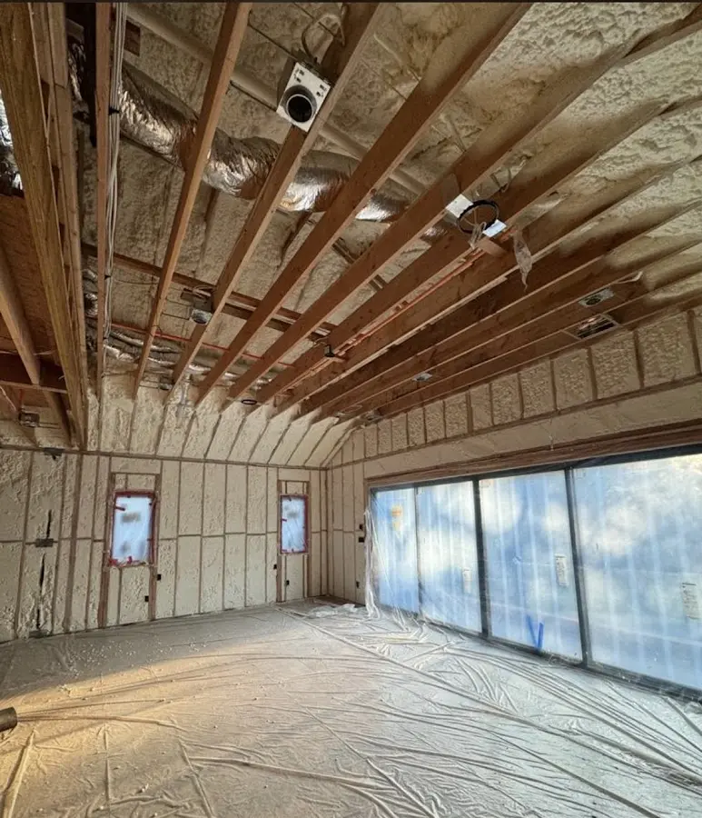 Interior walls and ceiling insulated with spray foam during new construction in Hudson Falls